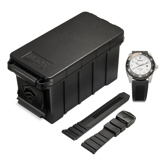 Overhead View of Kore Essentials Altitude Tactical Field Watch with Black Kore Essentials Ammo Case Box and a Spare Kore Essentials Micro-Adjustable Watch Band
