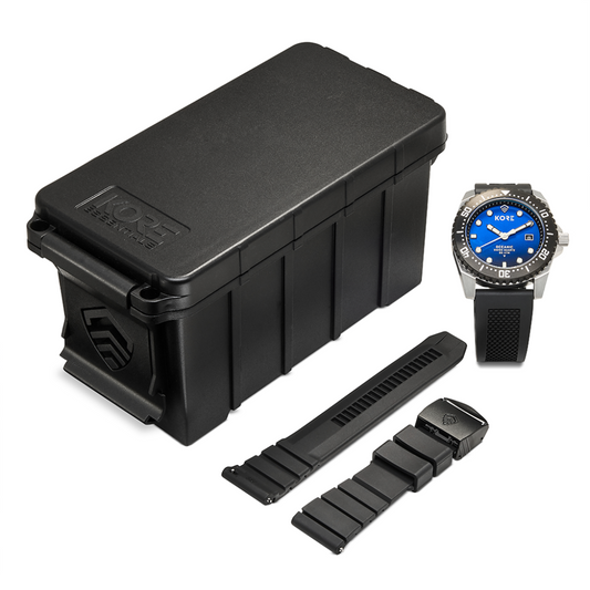 Overhead View of Kore Essentials Oceanic Tactical Field Watch with Black Kore Essentials Ammo Case Box and a Spare Kore Essentials Micro-Adjustable Watch Band