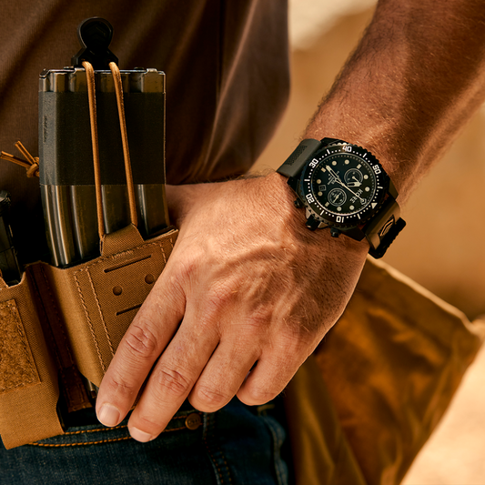 Close-up View of Man Wearing Kore Essentials Abyss Tactical Dive Watch  with Hand Resting on Kore Battle Belt